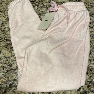 Fabletics go to sweatpant in heathered pink.